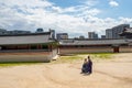 The view of the foreigners dressed in hanbok and walking at Gyeongbokgung Palace in Seoul, South Korea