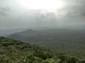 The view of a forest and green plants and rain bearing clouds in monsoon season from a mountain in indore india Royalty Free Stock Photo