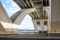 View form below of the structure of a large road bridge over a river Royalty Free Stock Photo