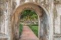 View into a formal garden through an arch at the Temple of Literature in Hanoi, Vietnam Royalty Free Stock Photo