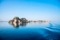 View of the fortress of Corfu from the sea in the morning mist with a trace of waves from the ferry. popular tourist attractions. Royalty Free Stock Photo