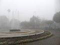 View of fountain in square Dante Alighieri in Caxias do Sul with fog