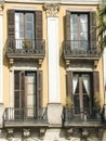 Four windows with balconys on a wall background Royalty Free Stock Photo