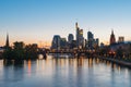 View of Frankfurt am Main skyline at dusk along Main river with Royalty Free Stock Photo