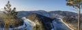 View of the freezing Manu river in autumn from the mountain. Nature of Siberia, beautiful landscape. the snow coating on the trees