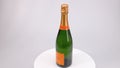 View of French champagne Veuve Clicquot, isolated on a rotating surface.