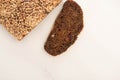 View of fresh brown bread slice and loaf on white background Royalty Free Stock Photo