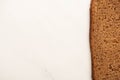 View of fresh brown bread slice on white background with copy space Royalty Free Stock Photo