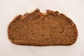 View of fresh brown bread slice on white background Royalty Free Stock Photo