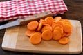 Fresh sliced carrots on wooden board Royalty Free Stock Photo