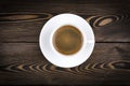view of a freshly brewed mug of espresso coffee on rustic wooden background with woodgrain texture. Coffee break style, concept. Royalty Free Stock Photo