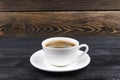 Overhead view of a freshly brewed mug of espresso coffee on rustic wooden background with woodgrain texture. Coffee break style Royalty Free Stock Photo