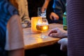 View on friends having alcoholic drinks in the bar, close-up Royalty Free Stock Photo