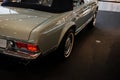 View fron the top ontrunk and side of grey retro cabriolet car with close up of right chrome backlight and exhaust pipe Royalty Free Stock Photo