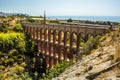 A view of the front face of the majestic, four storey, Eagle Aqueduct showing the Mudejar decoration near Nerja, Spain Royalty Free Stock Photo