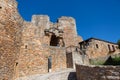 View at the front gate and fortress ruins at the castle on medieval village of Figueira de Castelo Rodrigo, tourists visiting the