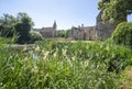 View of the front of Great Chalfield Manor looking across a pond