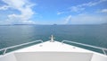 view of front luxury speedboat with a beautiful ocean and mountain in background