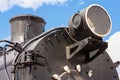 View of the front of the old steam locomotive with the smokestack, headlight and smokebox door Royalty Free Stock Photo