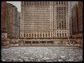 View of frozen Chicago River and snowflakes during heavy morning snowfall. Royalty Free Stock Photo