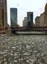 View of frozen Chicago River and snowflakes during heavy snowfall. Royalty Free Stock Photo