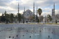 View of the frozen city fountain and the Blue mosque on a winter day. Istanbul Royalty Free Stock Photo