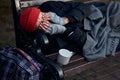 View of frozen old man lying on bench in city park in cold weather Royalty Free Stock Photo