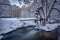 View of a frozen snowy water wheel in winter Royalty Free Stock Photo