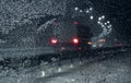 View through frozen windshield on the winter road during snowfall Royalty Free Stock Photo