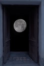 view of the full moon through the open door
