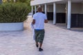 View of a funny tourist in shorts that are about to fall off him.