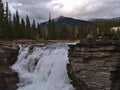 View of furious waterfall Athabasca Falls in Jasper National Park, Alberta, Canada in the Rocky Mountains between eroded rocks. Royalty Free Stock Photo