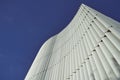 View of the futuric building. White slats against the blue sky. Background Business