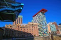 View on futuristic buildings in harbor against dark blue cloudless sky focus on colorful colorium building