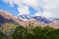 View of Gabbio Alps and clouds. Piedmont, Italy. Green vegetation on the foreground. Cloudy day. Copy space Royalty Free Stock Photo