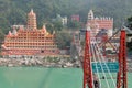 View of Ganga river embankment, Lakshman Jhula bridge and Tera Manzil Temple, Trimbakeshwar in Rishikesh Royalty Free Stock Photo