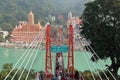 View of Ganga river embankment, Lakshman Jhula bridge and Tera Manzil Temple, Trimbakeshwar in Rishikesh Royalty Free Stock Photo