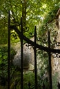 View of garden bench through an open wrought iron gate Royalty Free Stock Photo