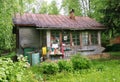 View from garden to terrace with kitchen utensils of old wooden house Royalty Free Stock Photo