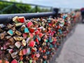 View of gardens with pedestrian walkways and many padlocks hanging on the railings Royalty Free Stock Photo