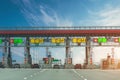 View gate for cars at the entrance to the toll road, limited by the barrier. Cashless payment transponder, speed limit