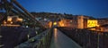 View of the gateway to a rope bridge at night in Constantine, Algeria