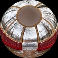 View from a gazebo with columns in a city park on a winter day. Shot through a circular fisheye lens