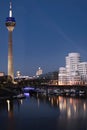 View of Gehry buildings and tv tower at Dusseldorf& x27;s media harbor at night