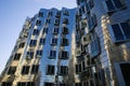 View on Gehry house with silver shiny futuristic metallic aluminium facade with offices