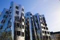 View on Gehry house with silver shiny futuristic metallic aluminium facade with offices