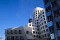 View on Gehry houses with modern futuristic facade, television tower background