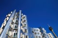 View on Gehry houses with silver shiny futuristic metallic aluminium facade with rheinturm