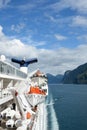 View of Geirangerfjord Norway from rear of cruise ship Magellan with lifeboats and funnel Royalty Free Stock Photo