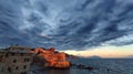 View of Genova Boccadasse under a cloudy sky at sunset, Italy